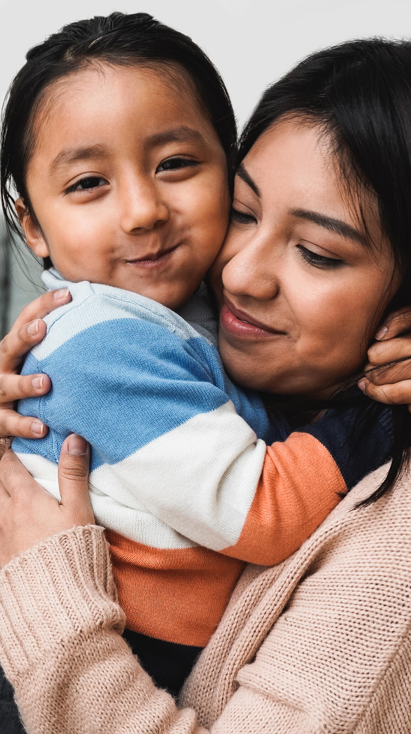 Mother and daughter hugging